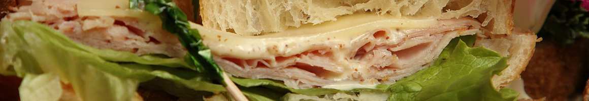 Eating Deli Sandwich at The Deli Llama restaurant in San Diego, CA.